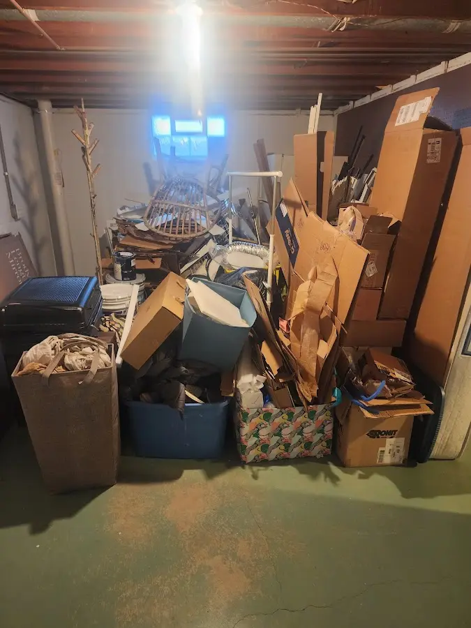 Roll-off dumpster container at job site for 6 Yard Dumpster Rental in Winooski